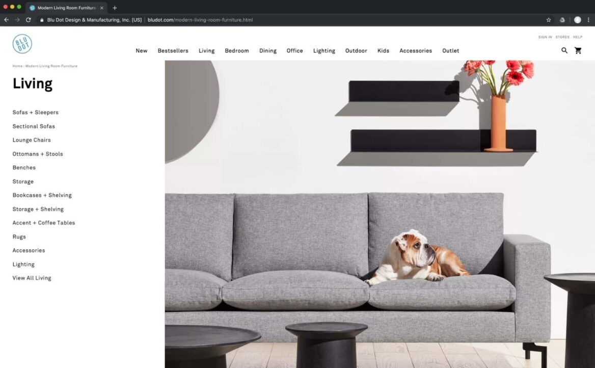Product page on BluDot's website showing a sofa and wall shelves.