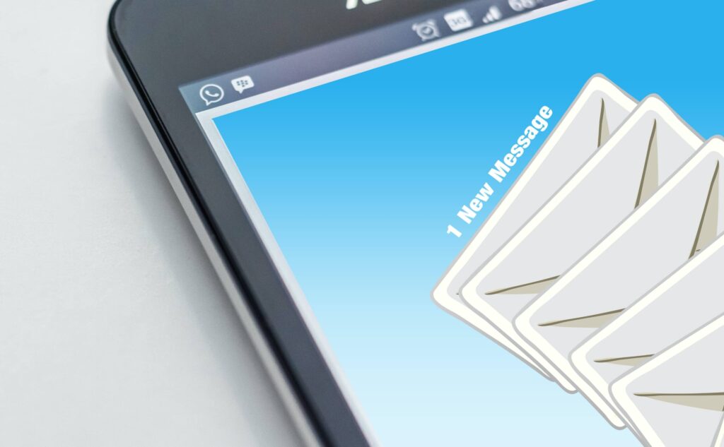 Closeup photo of Android tablet with graphic showing incoming email.