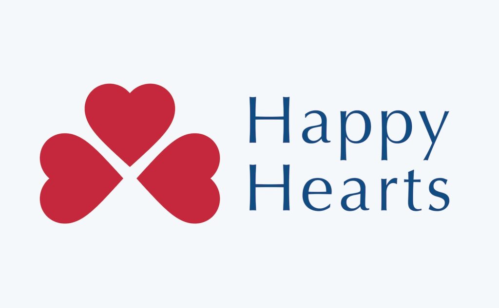 Happy Hearts full-color logo in trustworthy blue and appealing red.